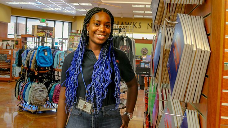 Student Bookstore employee smiling in CRC College Store